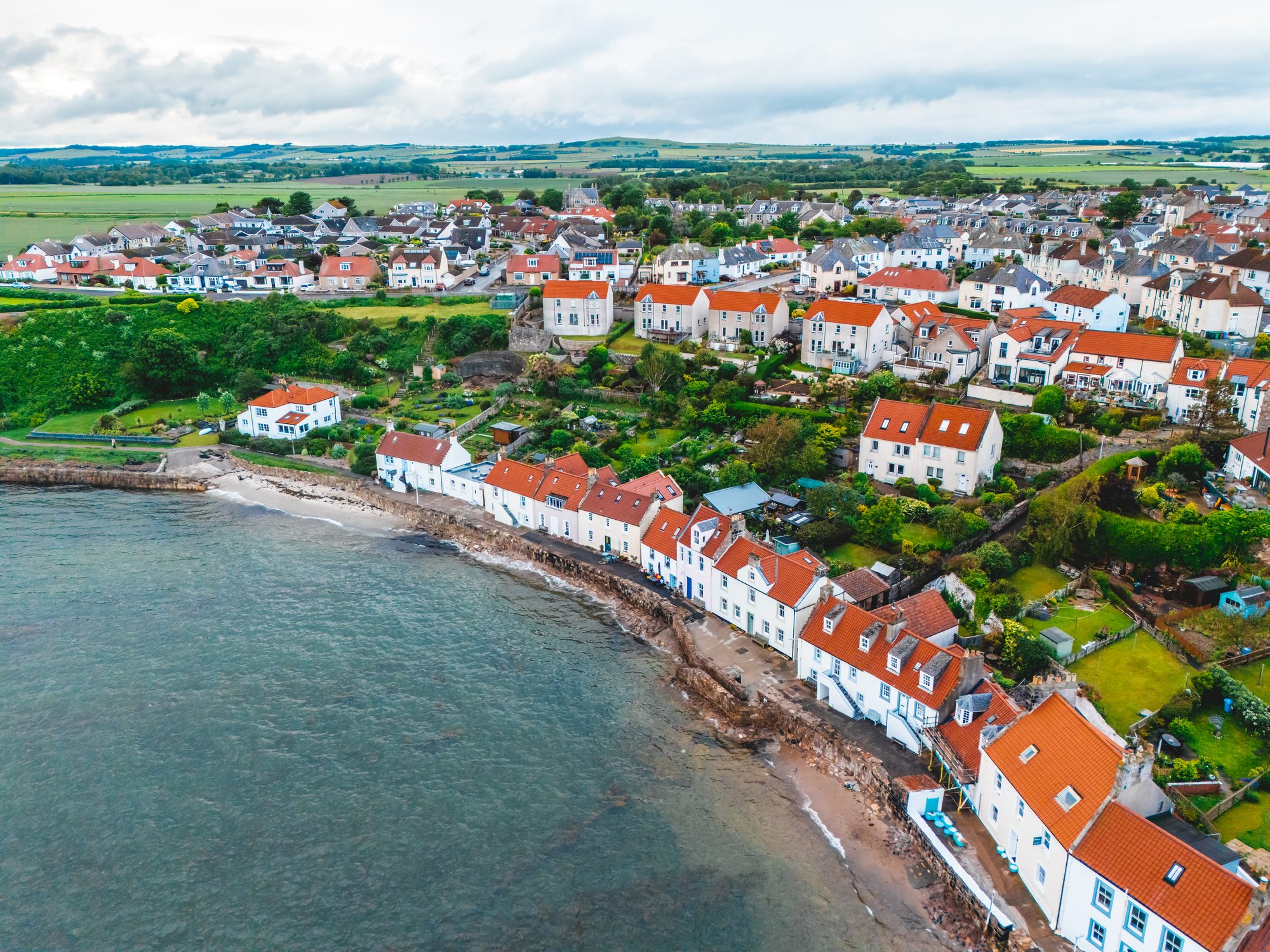 Aerial view of the West Shore shoreline and the village behind it